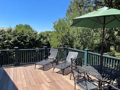 17 Kirby Road Washington, CT 06793 - Photo 12 of 20 a view of balcony with wooden floor and outdoor seating