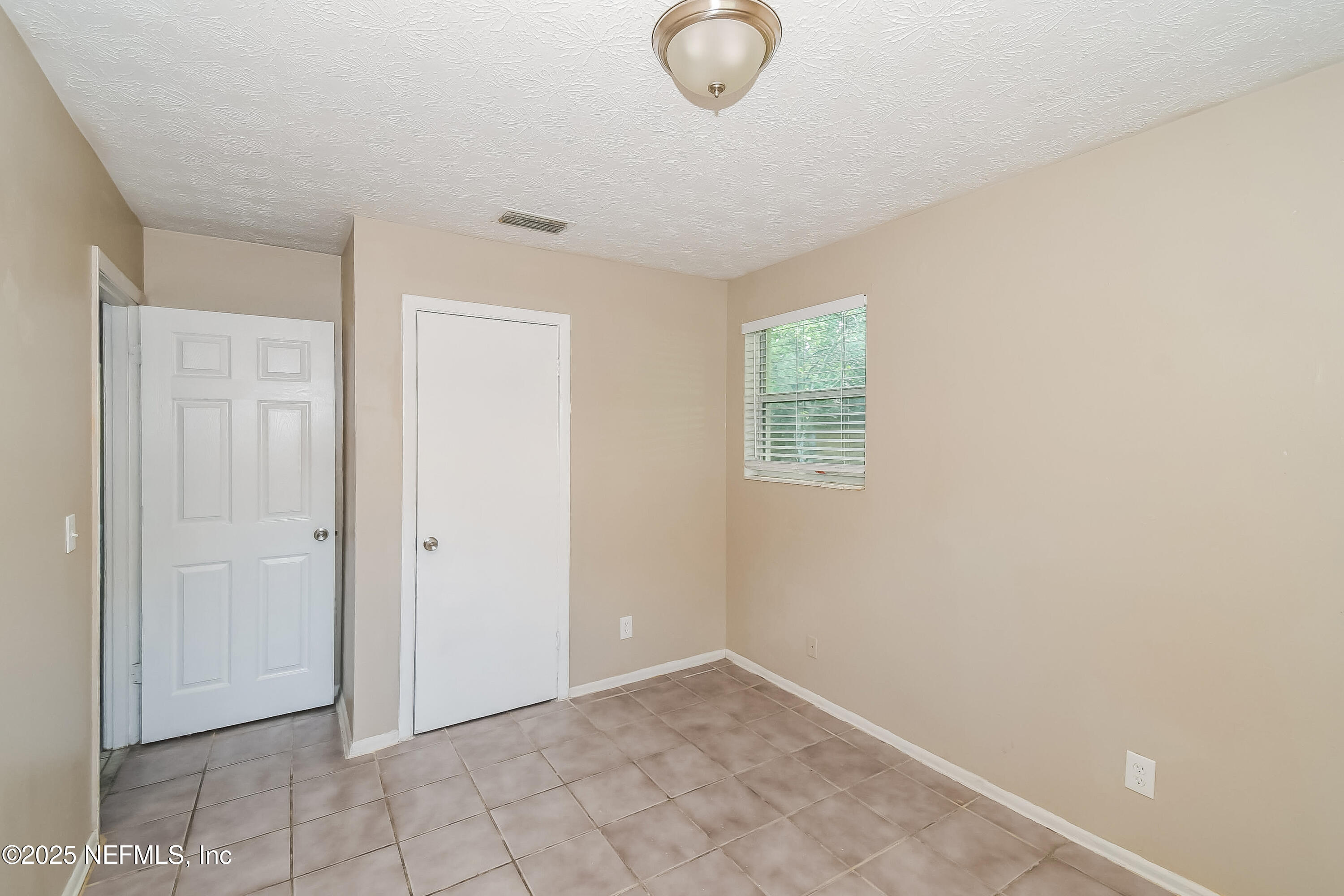 6430 Lucente Drive Jacksonville, FL 32210 - Photo 13 of 15 a view of an empty room