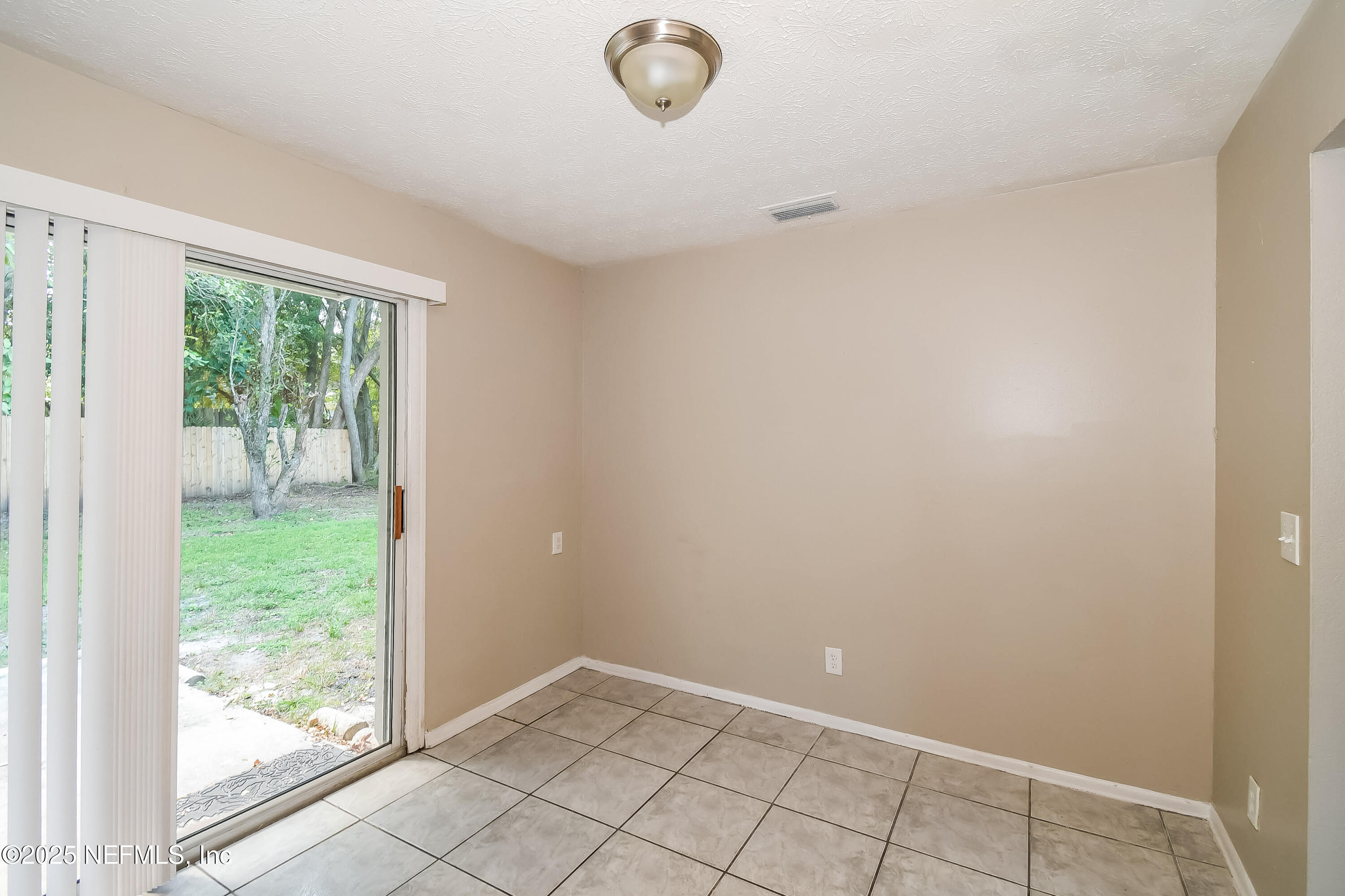 6430 Lucente Drive Jacksonville, FL 32210 - Photo 4 of 15 a view of empty room with window