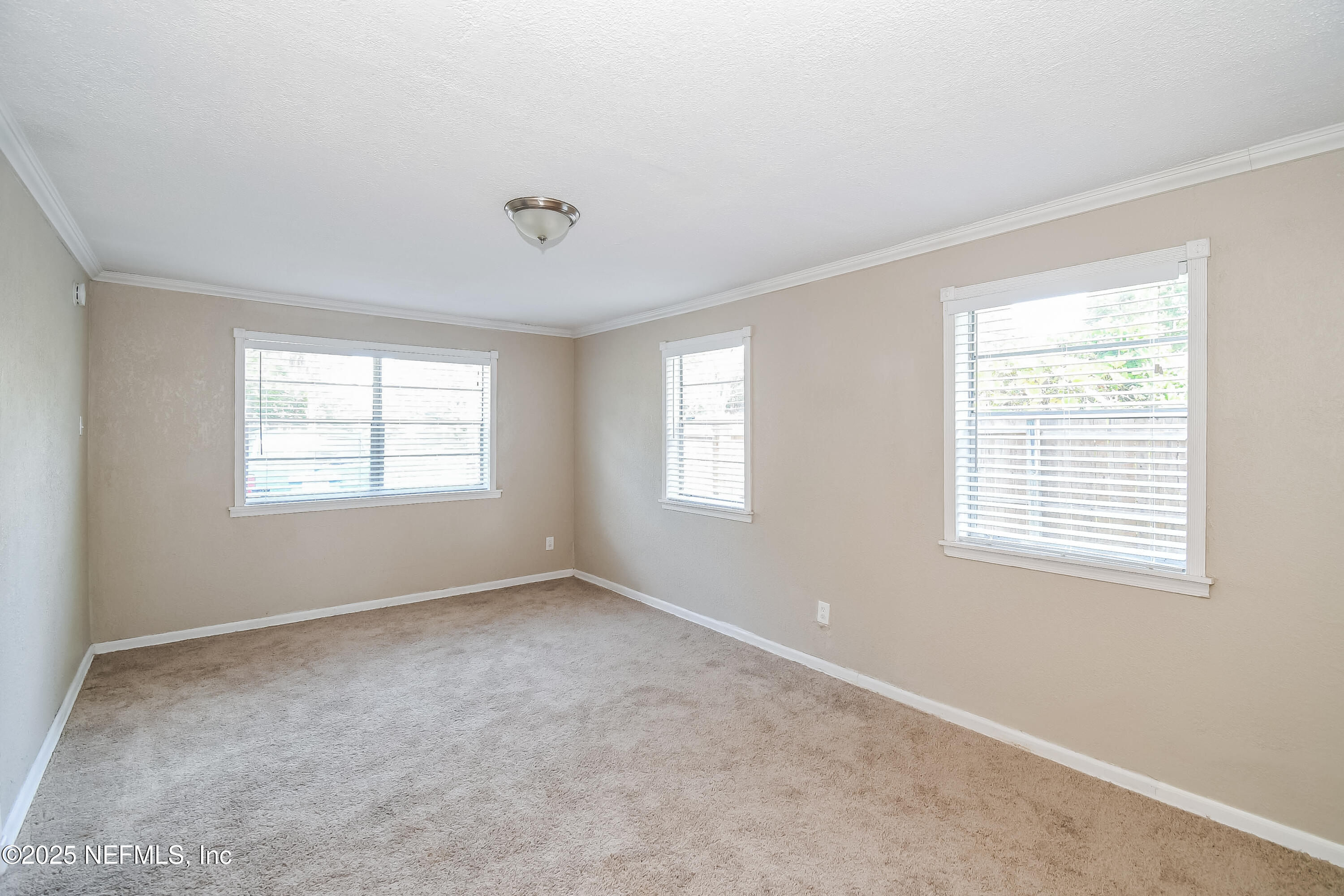 6430 Lucente Drive Jacksonville, FL 32210 - Photo 6 of 15 a view of an empty room with a window