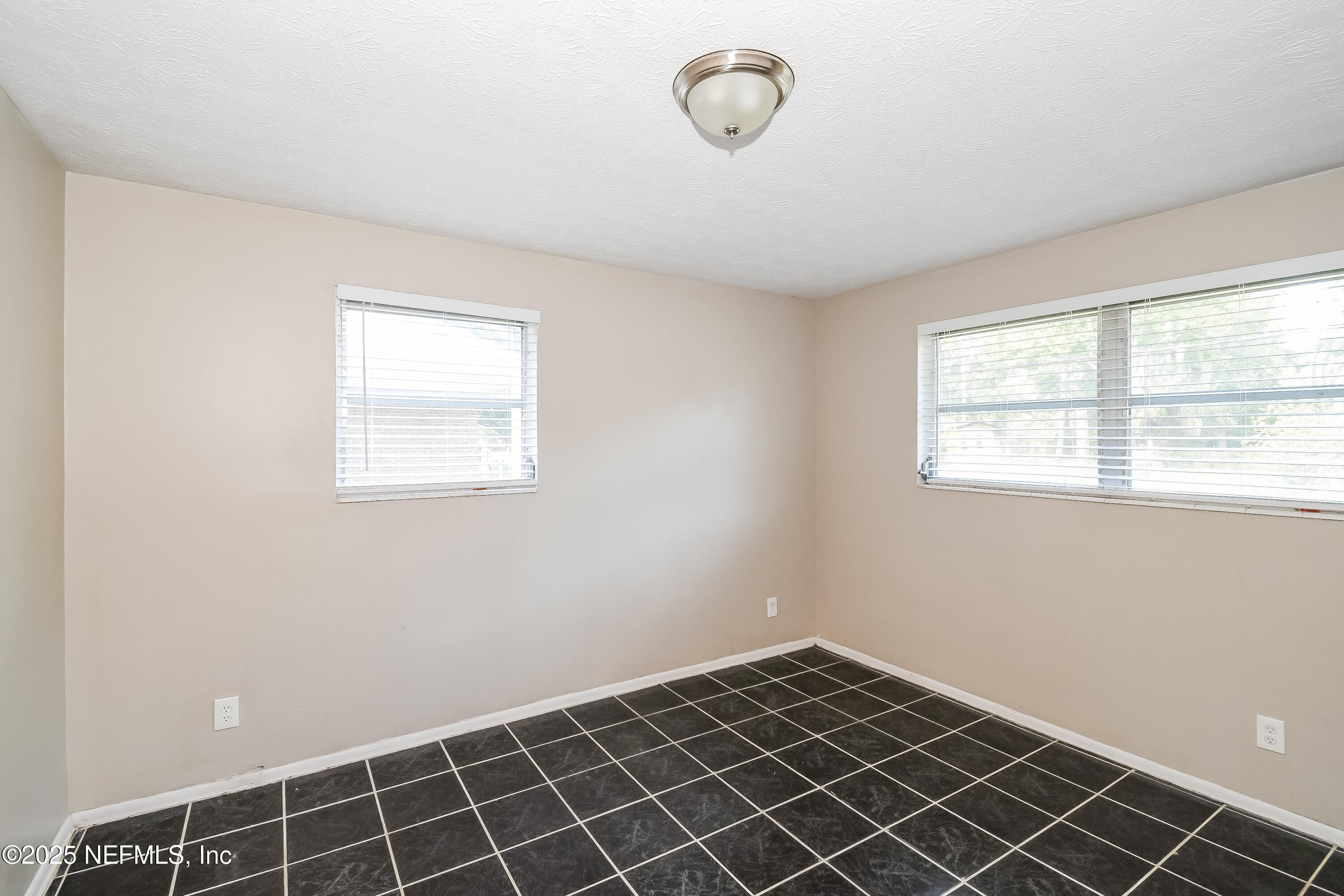 6430 Lucente Drive Jacksonville, FL 32210 - Photo 8 of 15 a view of an empty room with a window