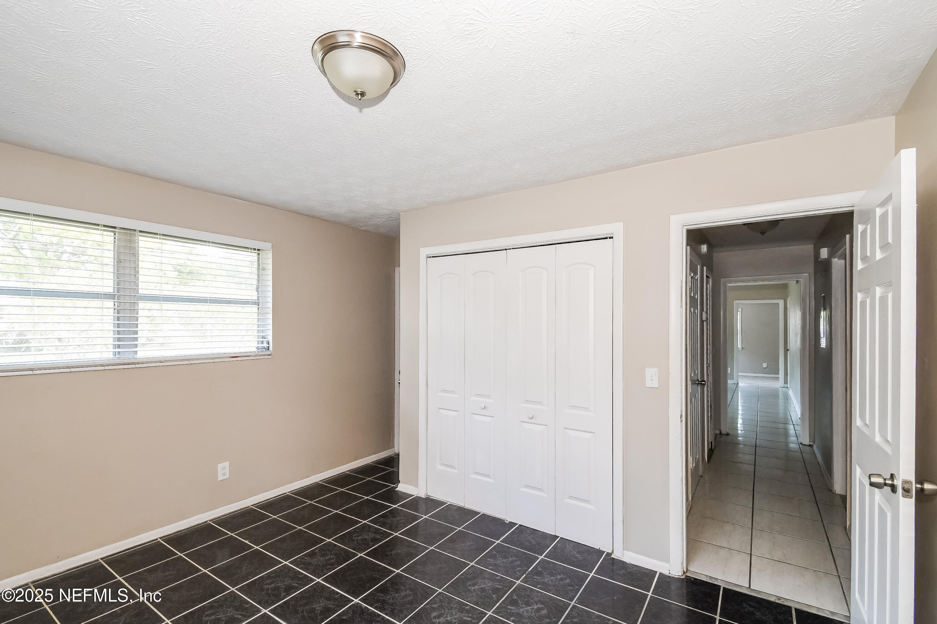 6430 Lucente Drive Jacksonville, FL 32210 - Photo 9 of 15 a view of a room with window