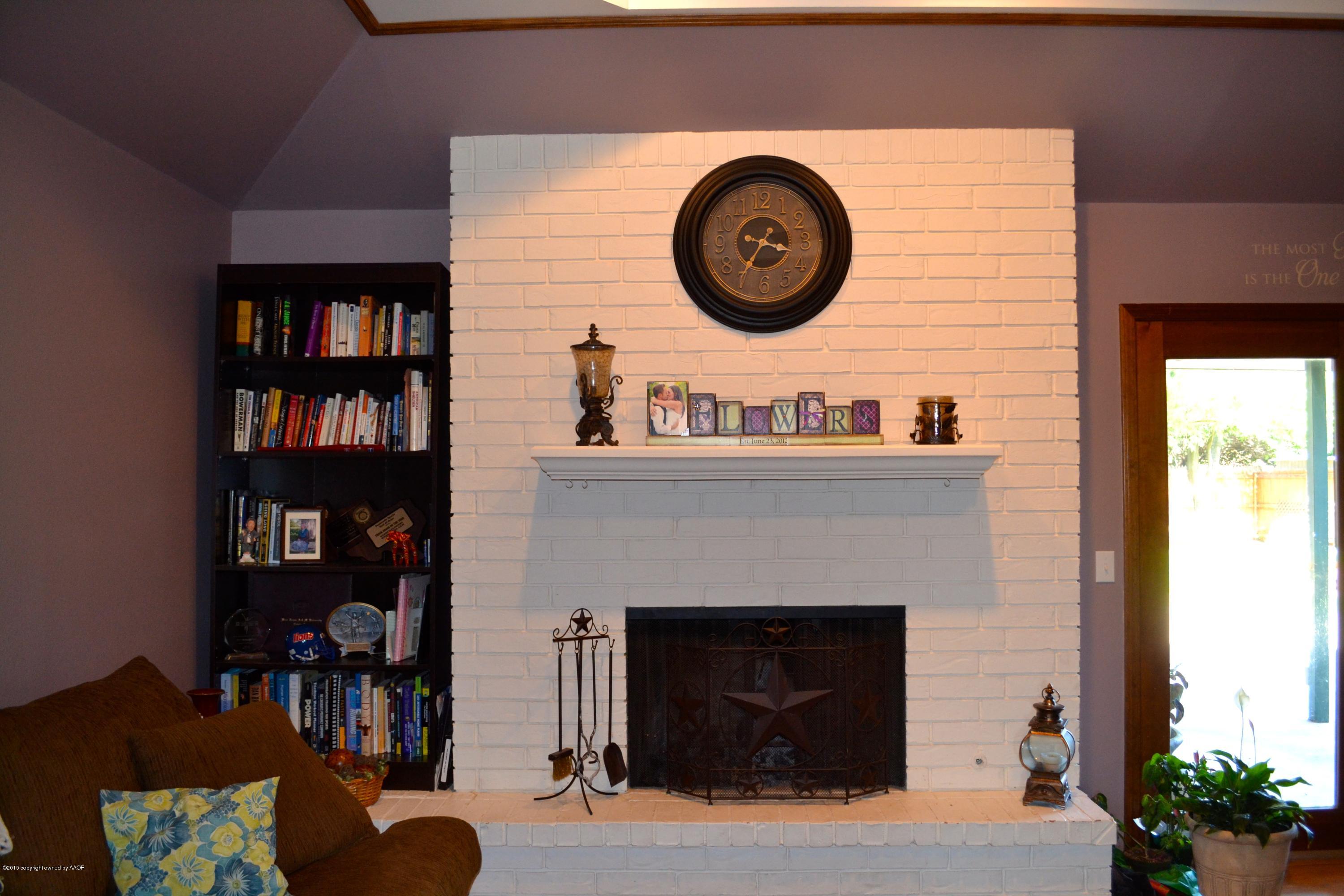 8305 Ranier Drive Amarillo, TX 79110 - Photo 8 of 54 a view of a livingroom with furniture and a fireplace