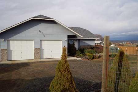 14809 Douglas Road Yakima, WA 98908 - Photo 3 of 6 a view of a house with a yard