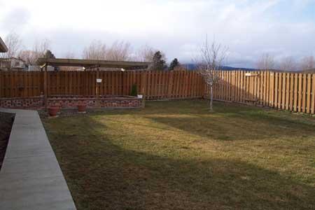 14809 Douglas Road Yakima, WA 98908 - Photo 6 of 6 a view of a backyard with wooden fence