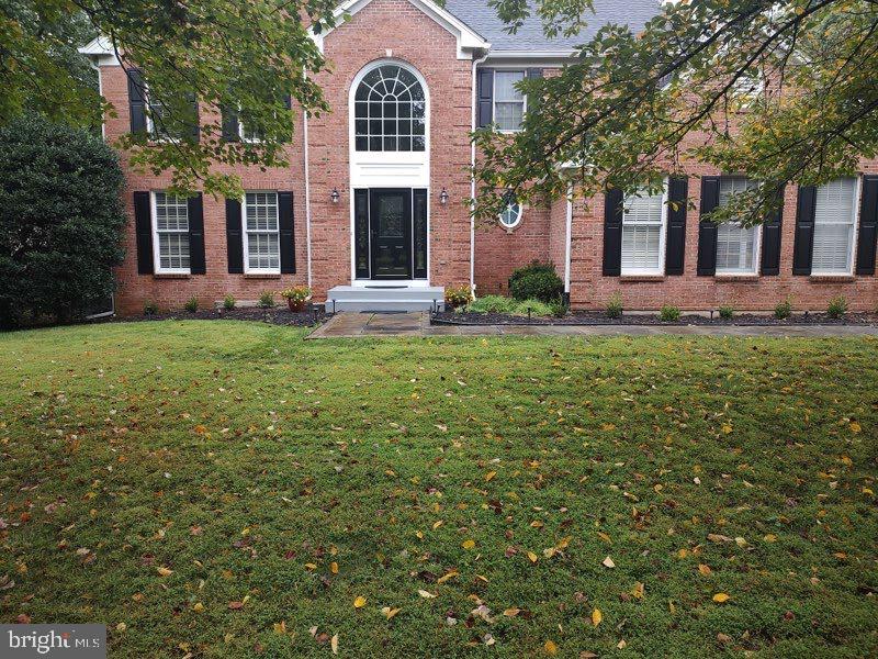 6529 Garden Grove Way Gaithersburg, MD 20882 - Photo 2 of 14 a front view of a house with garden