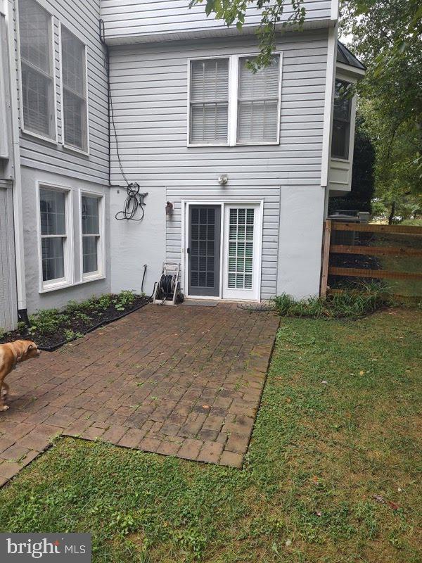 6529 Garden Grove Way Gaithersburg, MD 20882 - Photo 3 of 14 a front view of a house with garden
