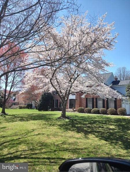 6529 Garden Grove Way Gaithersburg, MD 20882 - Photo 4 of 14 a view of a building with a big yard