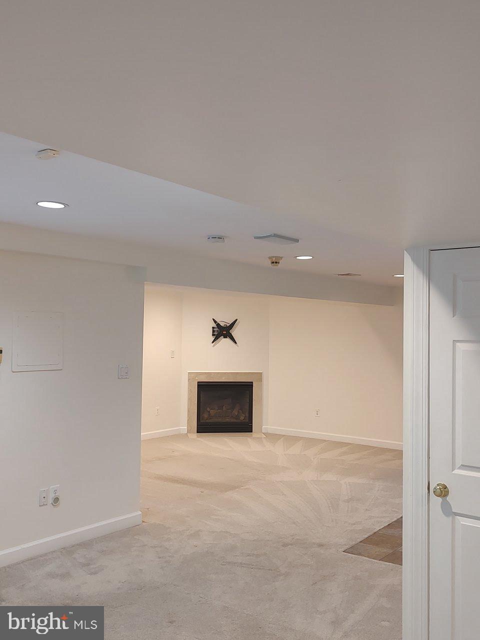 6529 Garden Grove Way Gaithersburg, MD 20882 - Photo 7 of 14 a view of an empty room and fire place