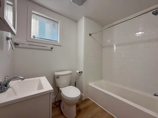 a bathroom with a toilet a sink and a bathtub