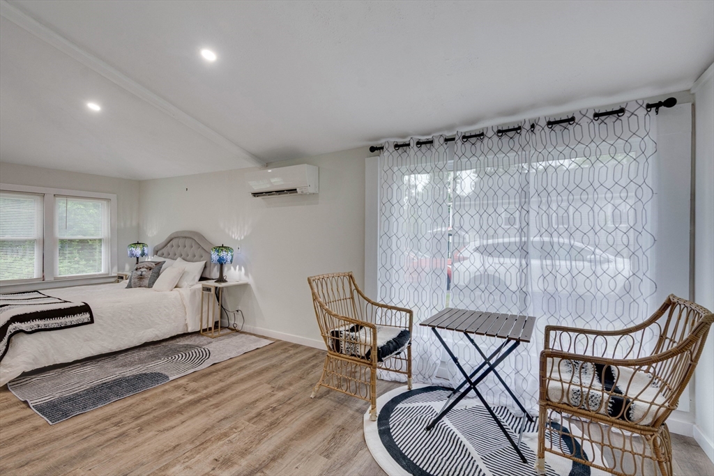 12 Temple Avenue Hudson, MA 01749 - Photo 11 of 32 a bed room with a bed and a chair