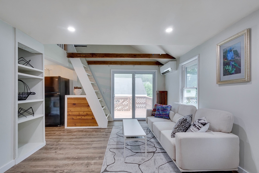 12 Temple Avenue Hudson, MA 01749 - Photo 15 of 32 a living room with furniture and a fireplace