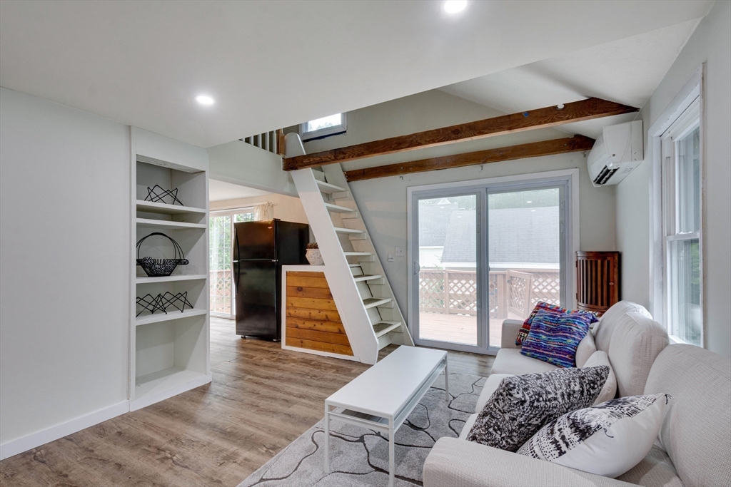 12 Temple Avenue Hudson, MA 01749 - Photo 16 of 32 a living room with furniture and a wooden floor