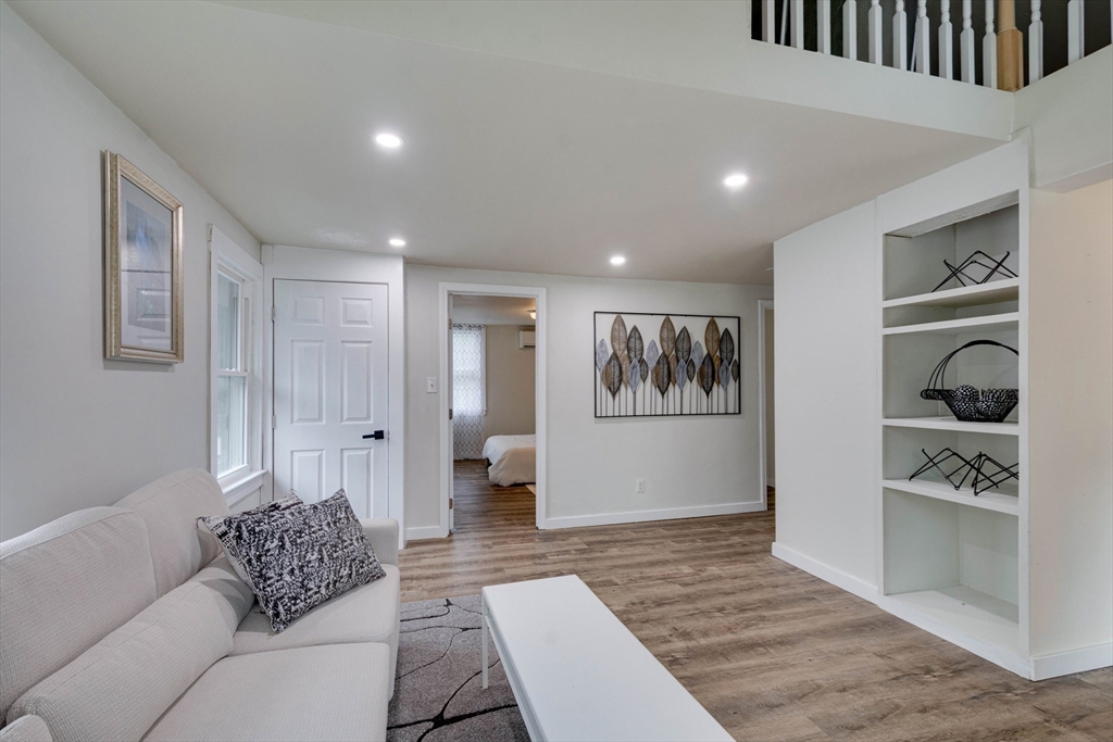 12 Temple Avenue Hudson, MA 01749 - Photo 17 of 32 a living room with furniture and a rug