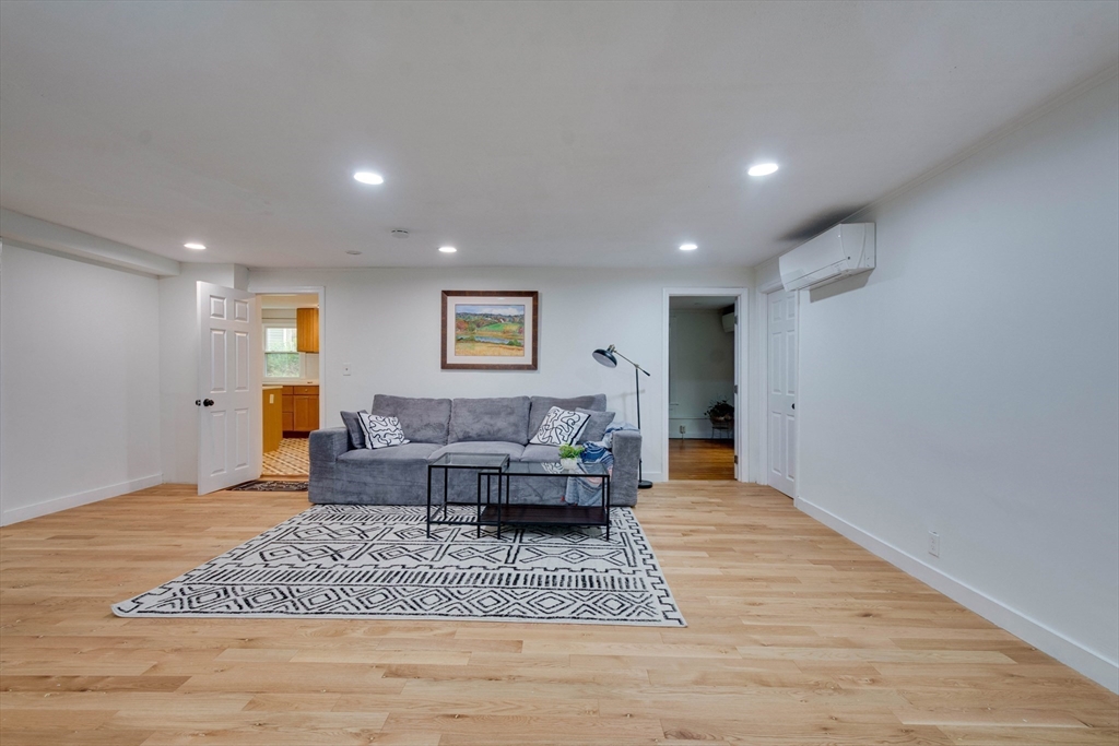 12 Temple Avenue Hudson, MA 01749 - Photo 6 of 32 a living room with furniture and a wooden floor