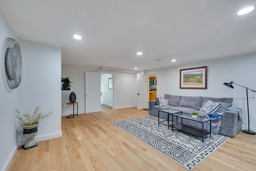 12 Temple Avenue Hudson, MA 01749 - Photo 7 of 32 a living room with furniture and a rug