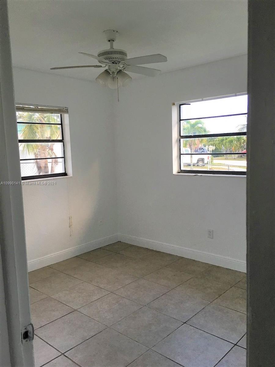 14535 Southwest 297th Terrace Homestead, FL 33033 - Photo 12 of 17 an empty room with a window
