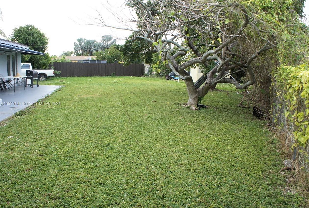 14535 Southwest 297th Terrace Homestead, FL 33033 - Photo 14 of 17 a view of a garden with a tree