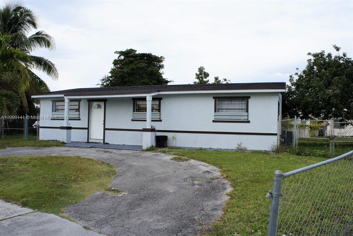 14535 Southwest 297th Terrace Homestead, FL 33033 - Photo 2 of 17 a house view with a garden space
