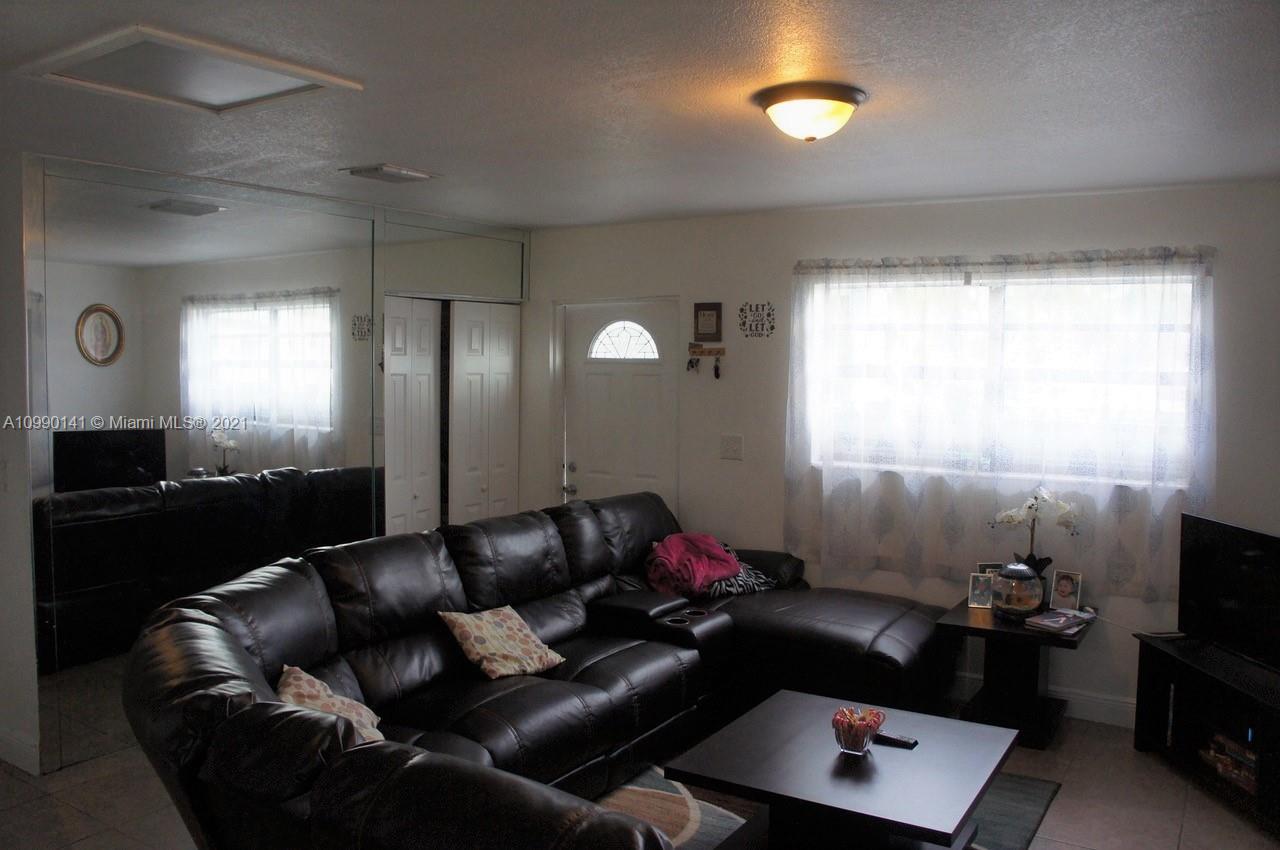 14535 Southwest 297th Terrace Homestead, FL 33033 - Photo 3 of 17 a living room with furniture and a window