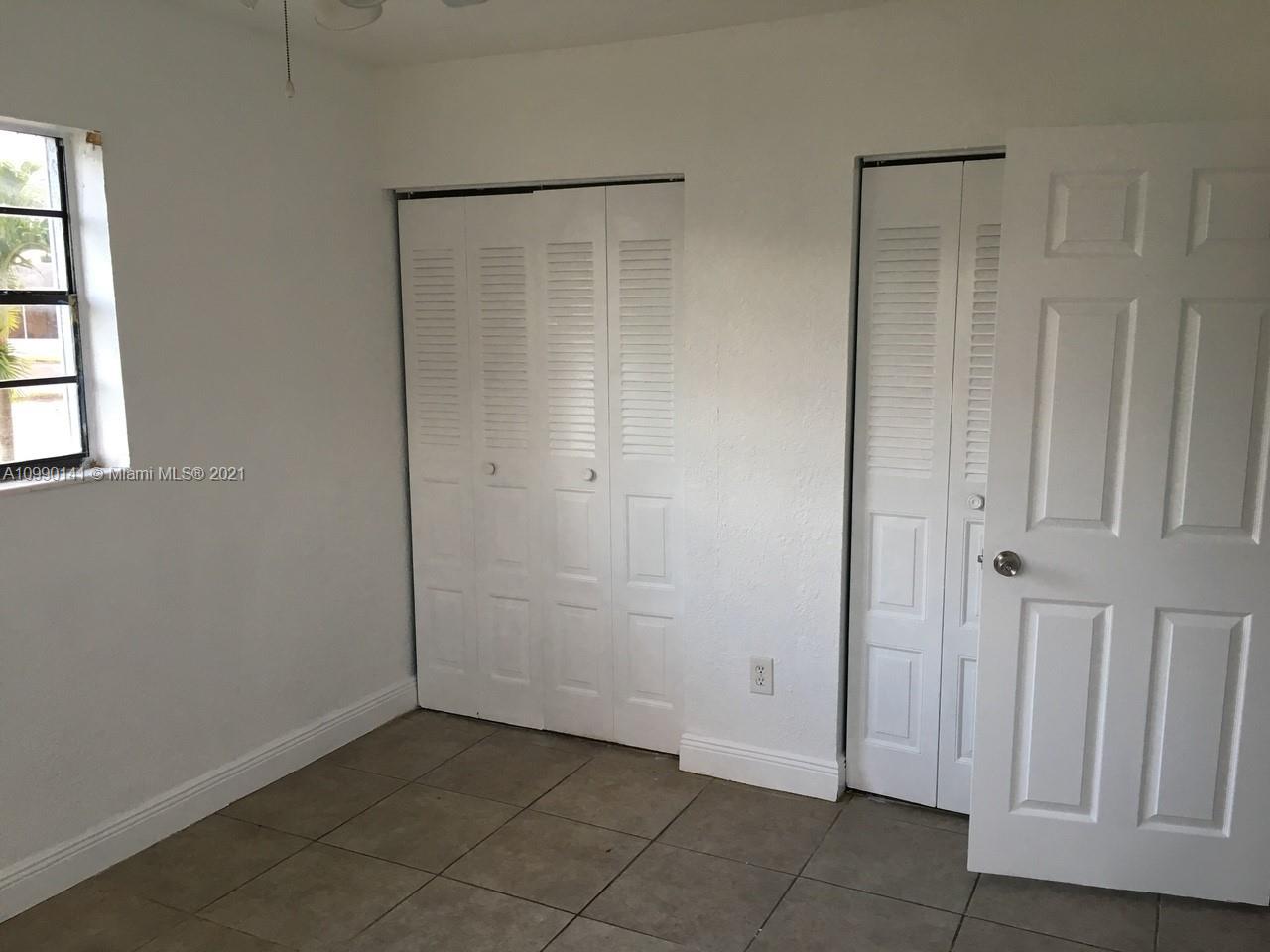 14535 Southwest 297th Terrace Homestead, FL 33033 - Photo 9 of 17 an empty room with windows