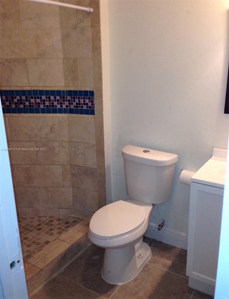 14535 Southwest 297th Terrace Homestead, FL 33033 - Photo 10 of 17 a bathroom with a toilet and a shower