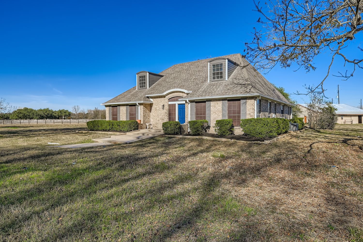 34411 Fulshear Farms Road Fulshear, TX 77441 - Photo 3 of 29 a front view of a house with a garden
