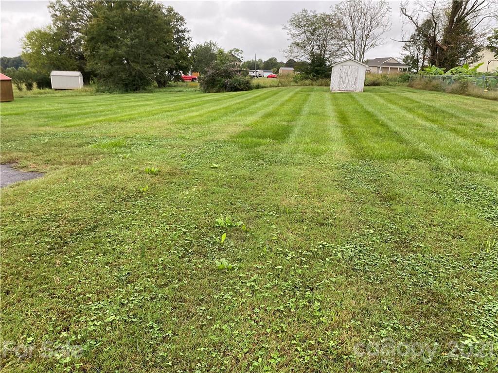 1033 Tabor Road Olin, NC 28660 - Photo 11 of 14 a view of a golf course with a trees