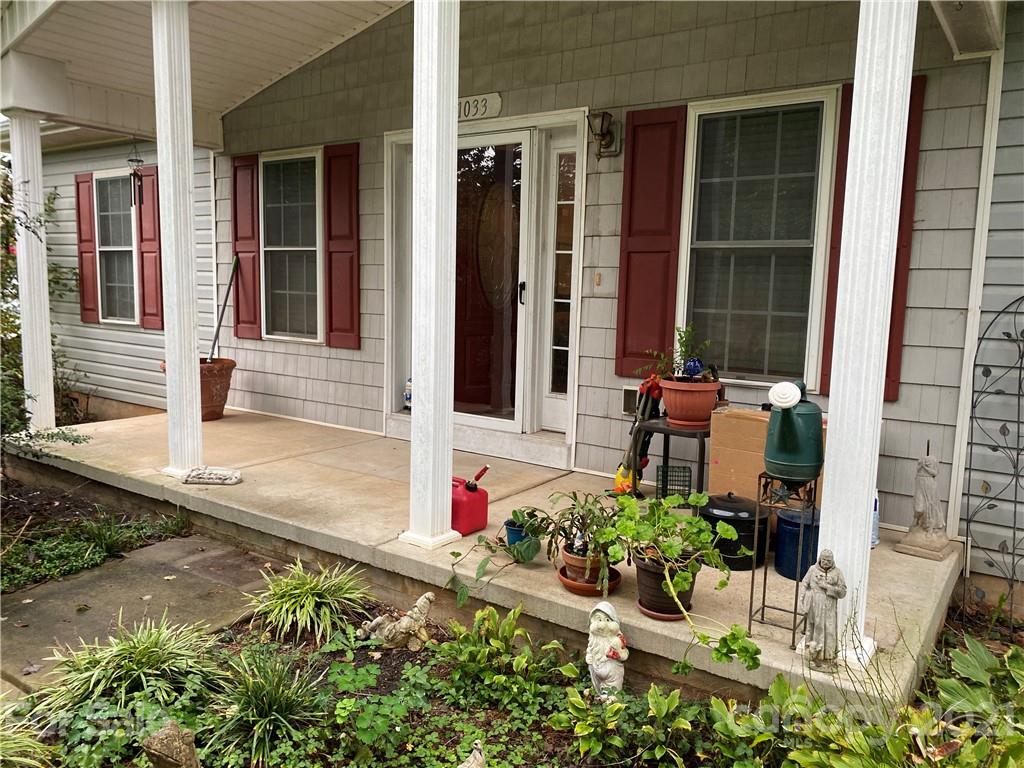 1033 Tabor Road Olin, NC 28660 - Photo 13 of 14 front view of a house with a yard