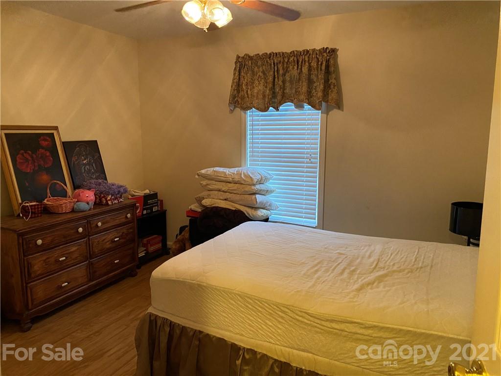 1033 Tabor Road Olin, NC 28660 - Photo 7 of 14 a bedroom with a bed and a flat screen tv