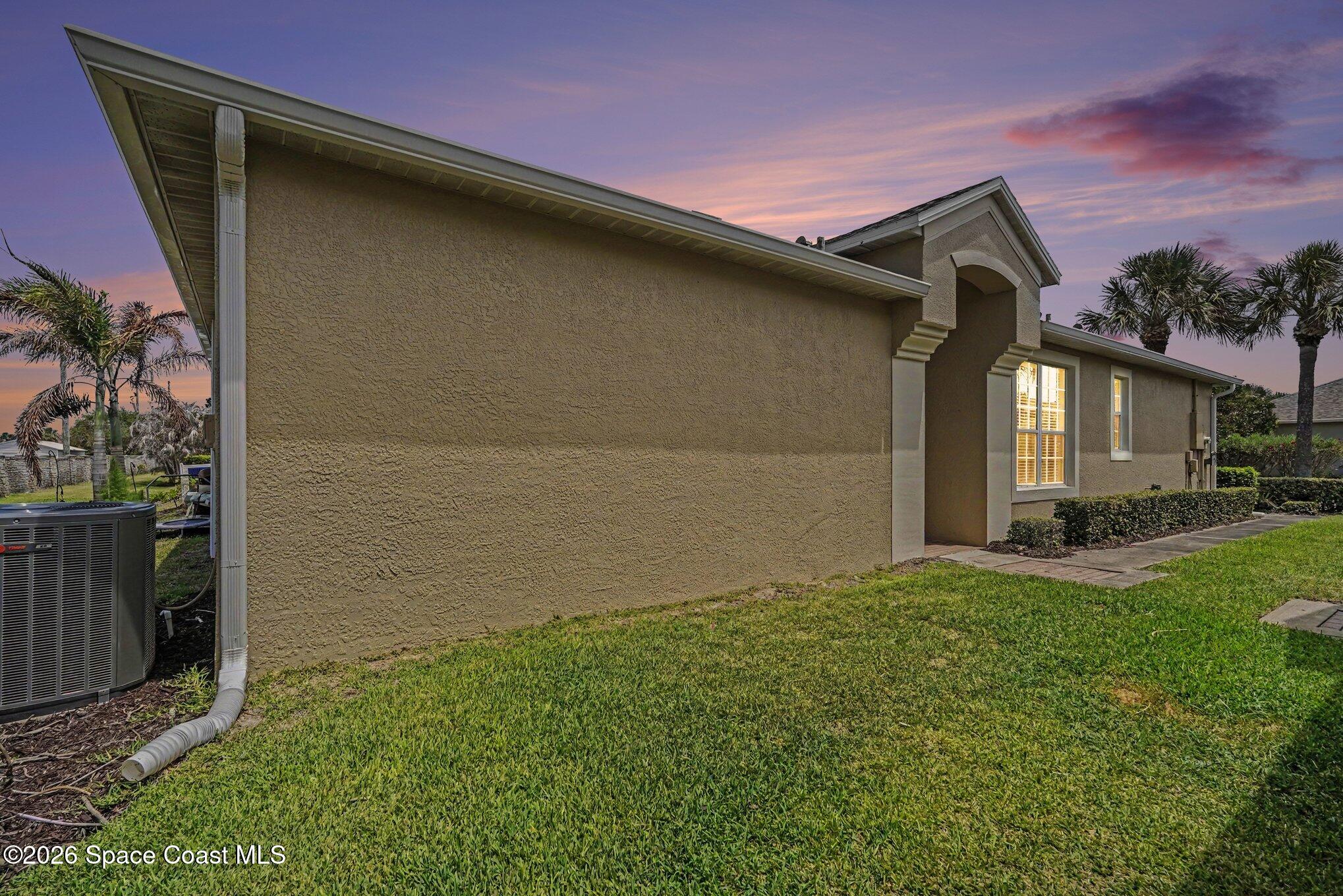 284 Intrepid Way Indialantic, FL 32903 - Photo 5 of 36 a backyard of a house with lots of green space
