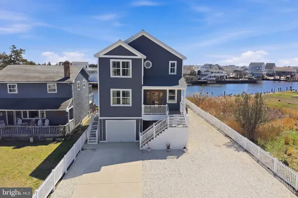 a front view of a house with lake view