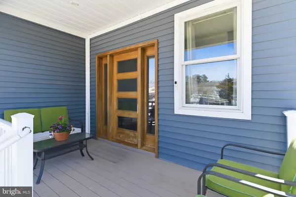 a bench is sitting in front of a door