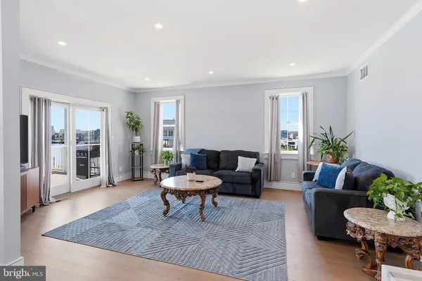 a living room with furniture and a rug
