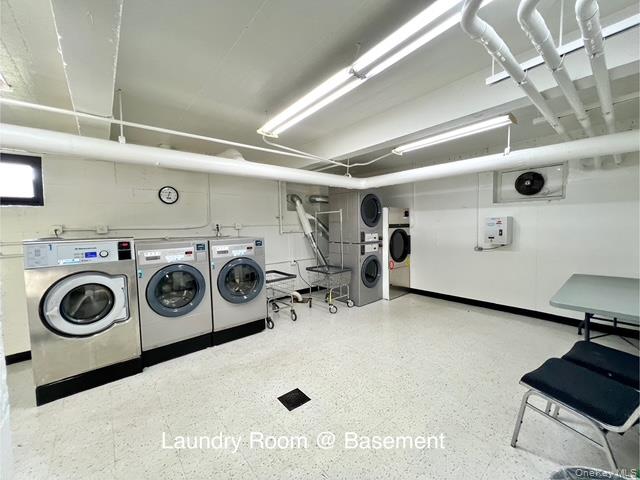 75-08 Bell Boulevard, Unit 2J Queens, NY 11364 - Photo 15 of 23 a utility room with dryer and washer