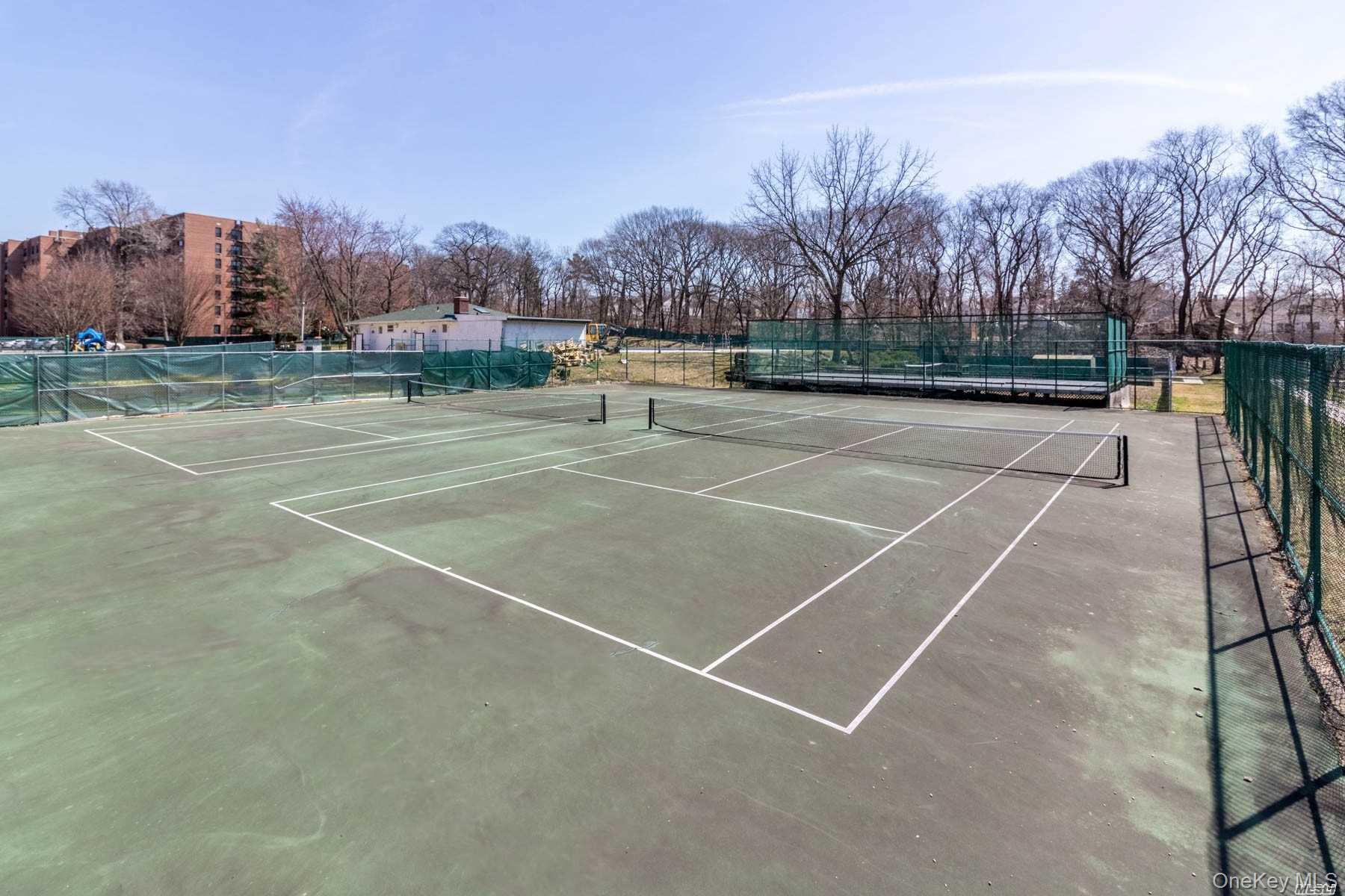 75-08 Bell Boulevard, Unit 2J Queens, NY 11364 - Photo 18 of 23 a view of a tennis court