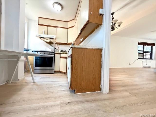 75-08 Bell Boulevard, Unit 2J Queens, NY 11364 - Photo 4 of 23 a view of a kitchen with a sink and a stove