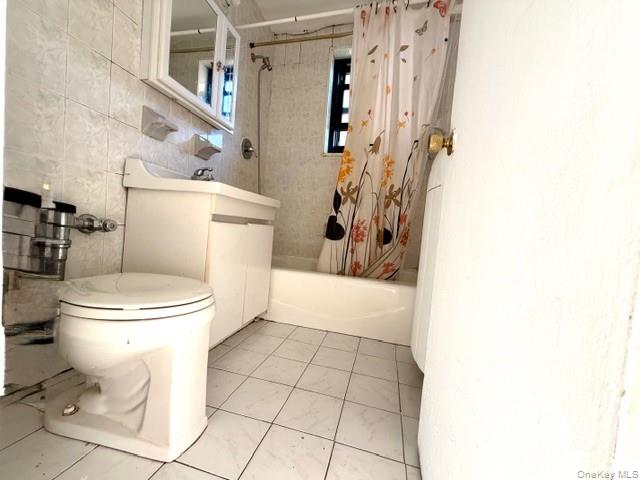 75-08 Bell Boulevard, Unit 2J Queens, NY 11364 - Photo 7 of 23 a bathroom with a toilet and a shower