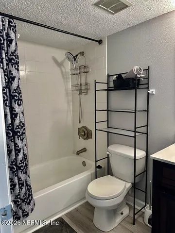 a bathroom with a toilet a sink and bathtub
