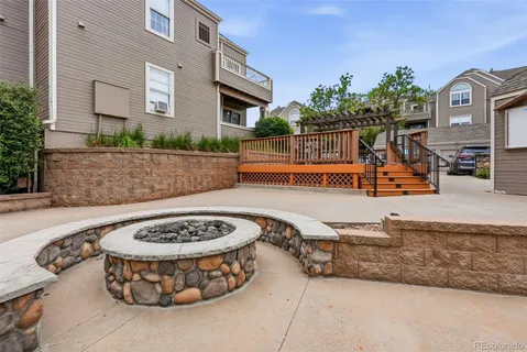 a view of house with outdoor seating and city view