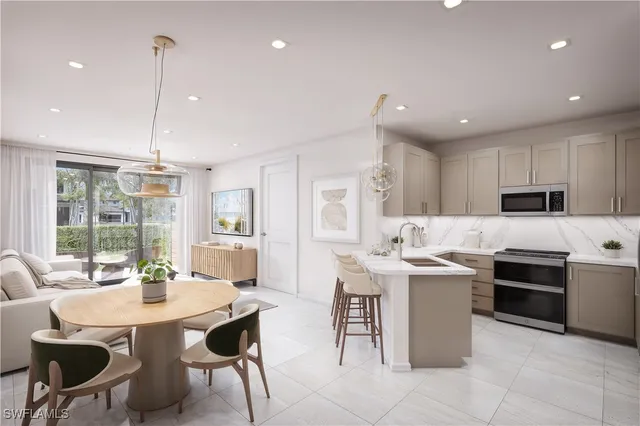 a kitchen that has a table and chairs in it