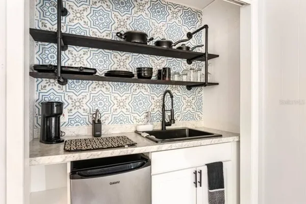 a kitchen with a stove and cabinets