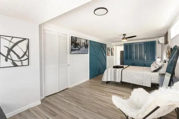 a bedroom with a bed and a couch