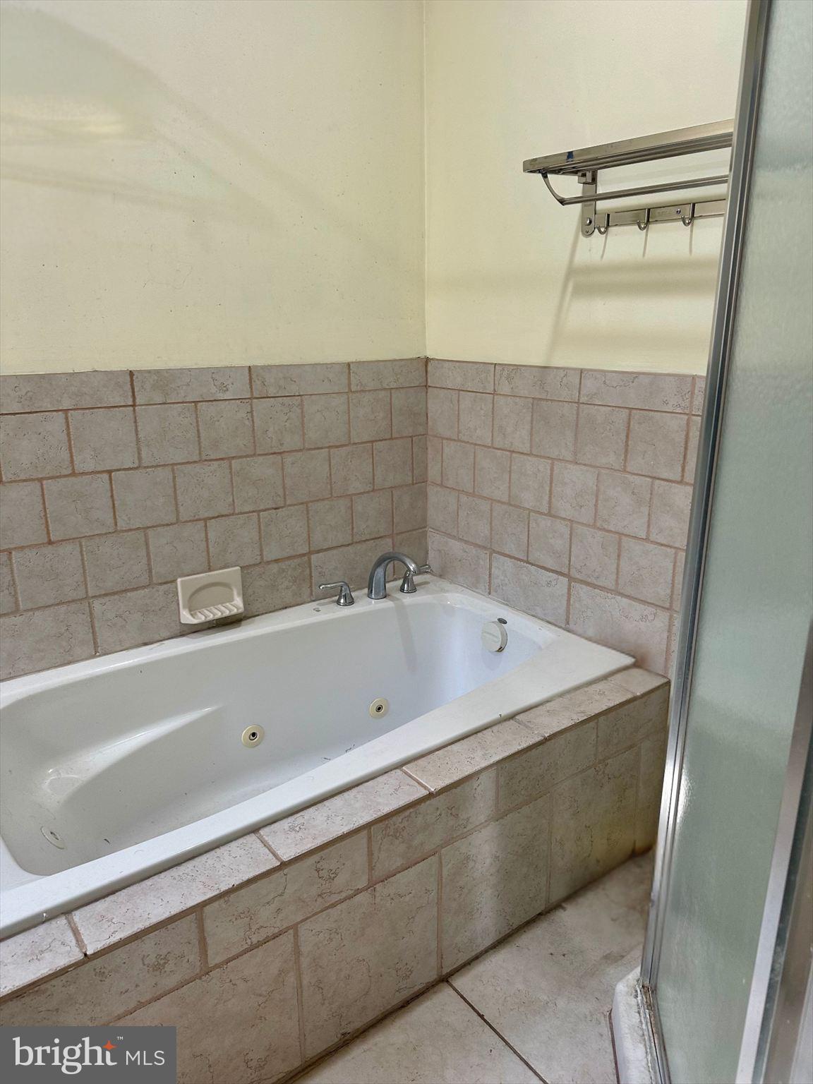 3918 Brandywine Street Philadelphia, PA 19104 - Photo 15 of 18 a bathroom with a bathtub and shower