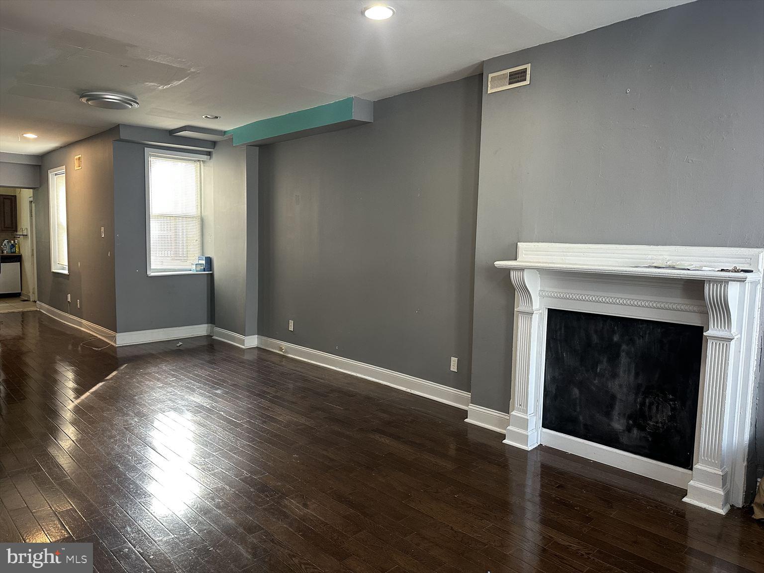 3918 Brandywine Street Philadelphia, PA 19104 - Photo 4 of 18 a view of an empty room with wooden floor and a window