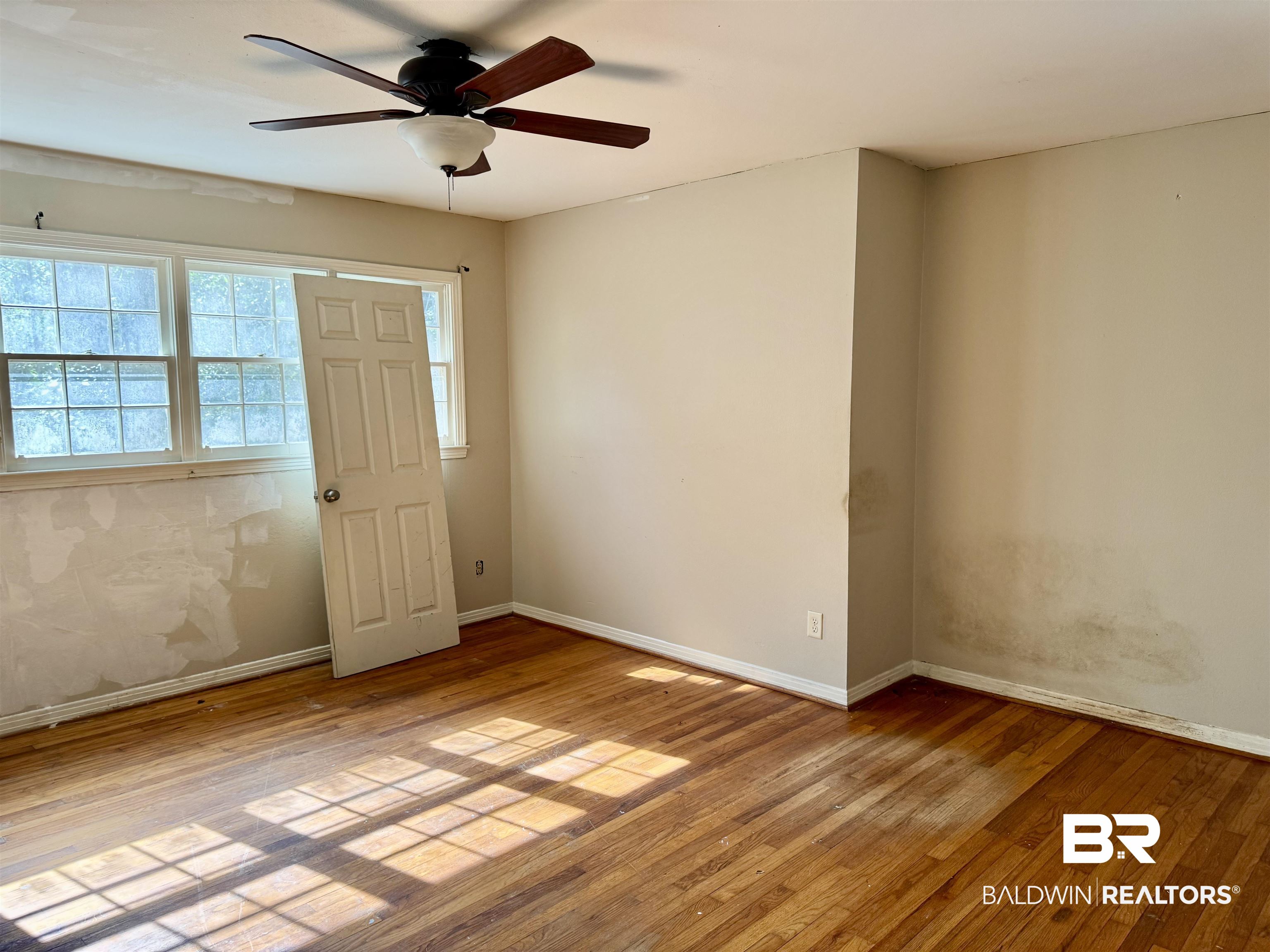 287 Wingfield Drive Mobile, AL 36607 - Photo 19 of 24 Empty room featuring baseboards and wood-type flooring