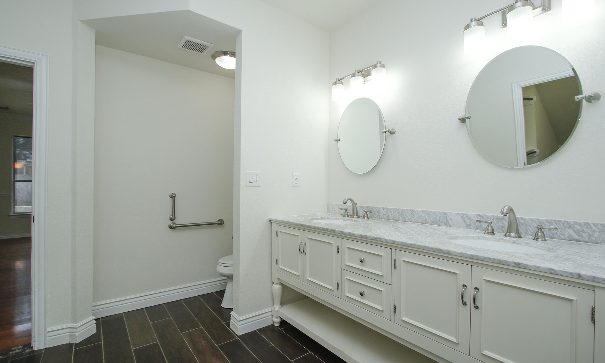 1210 Berwick Manor Court Spring, TX 77379 - Photo 2 of 50 a bathroom with a double vanity sink and a mirror