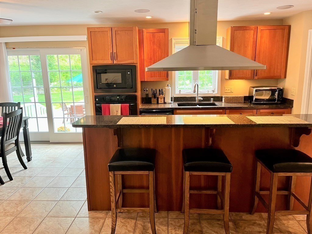 7 R Oxbow Road Oxford, MA 01537 - Photo 11 of 40 a dining room with furniture and wooden floor