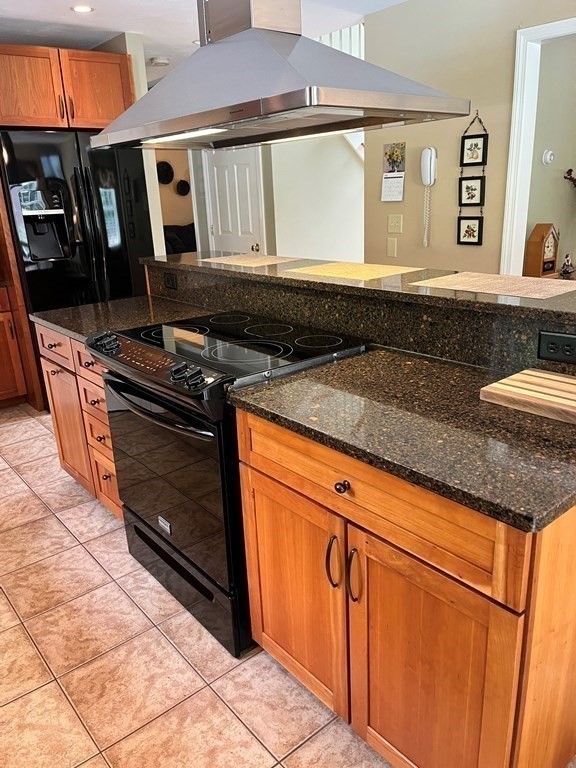 7 R Oxbow Road Oxford, MA 01537 - Photo 15 of 40 a kitchen with granite countertop a stove a sink and a microwave