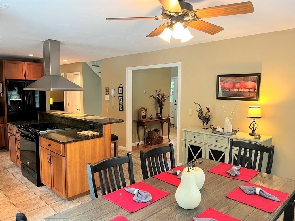 7 R Oxbow Road Oxford, MA 01537 - Photo 16 of 40 a view of kitchen island dining table and chairs